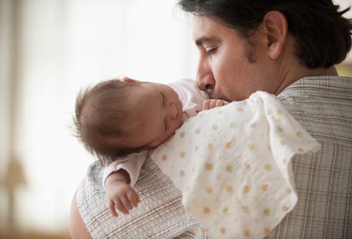 getty_rf_photo_of_father_holding_baby